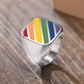 Spectrum Strength: Black and Silver Rings Burst with Pride